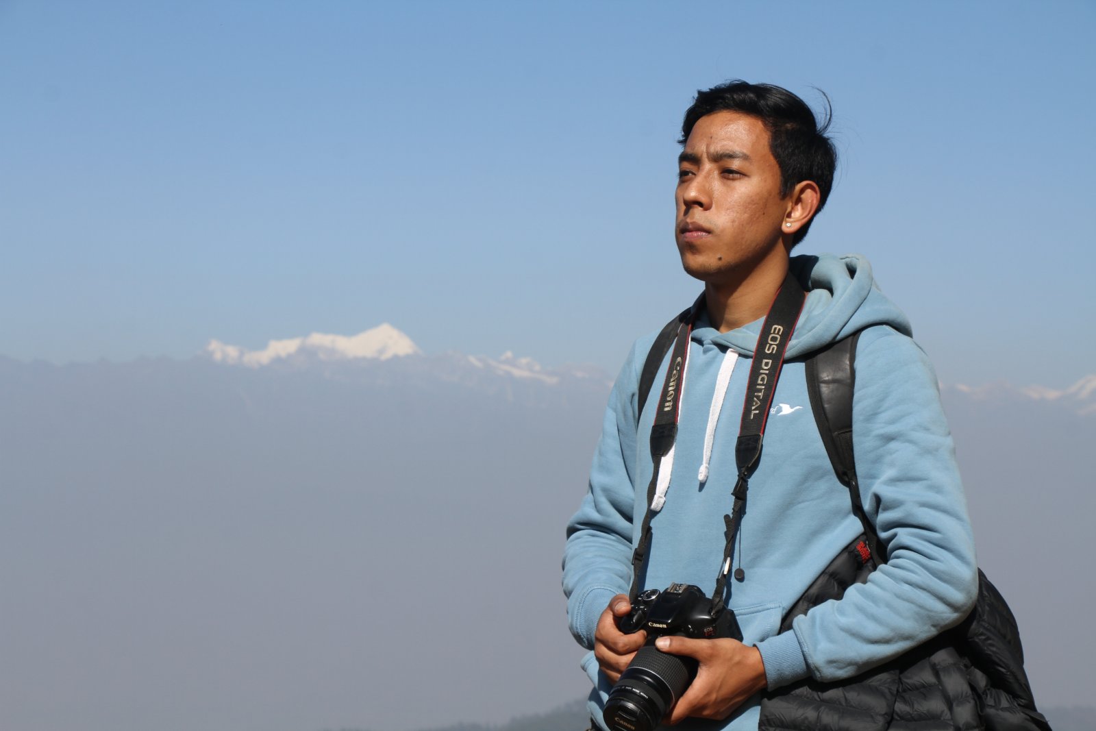 Srijan holding camera